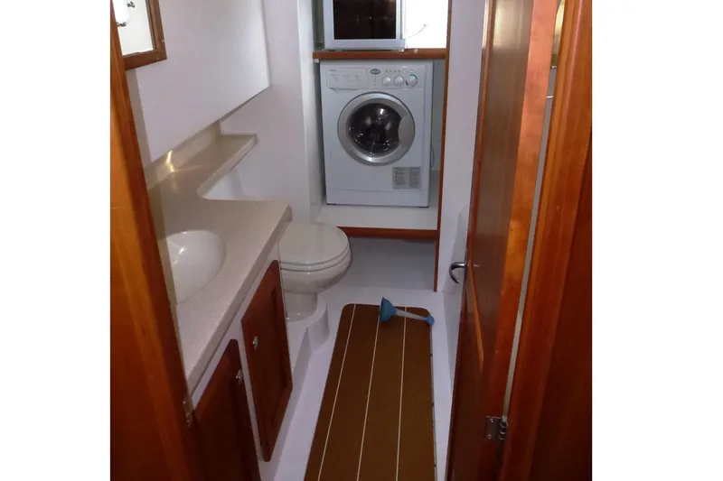 Slide: The Image of Compact bathroom with washer, toilet, and sink in 2009 Maine Cat P-47 model. - 26