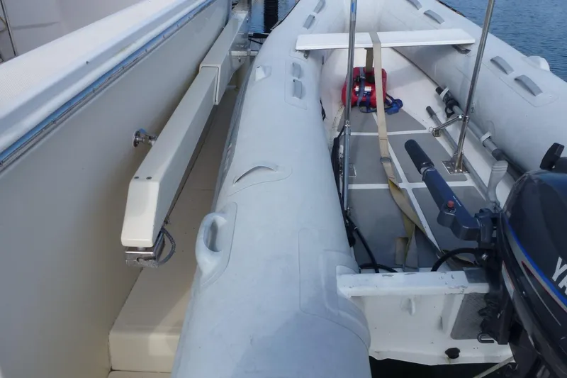 Slide: The Image of Inflatable boat with Yamaha motor beside Maine Cat P-47, 2009 model. - 27