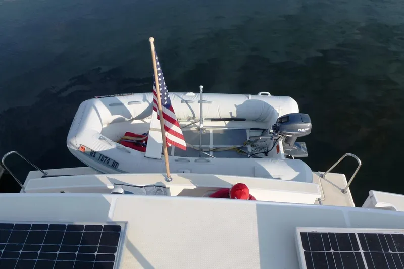 Slide: The Image of Top view of a 2009 Maine Cat P-47 with an inflatable boat and American flag. - 29