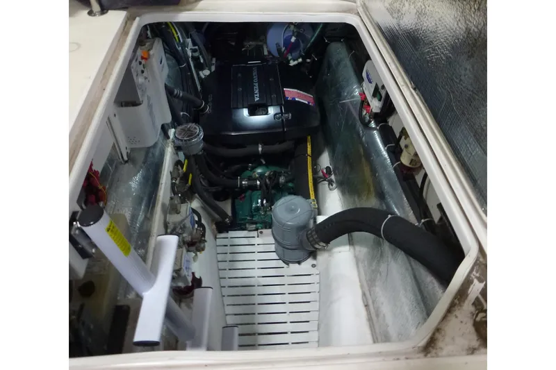 Slide: The Image of Engine compartment of a 2009 Maine Cat P-47, featuring a Volvo Penta engine. - 31