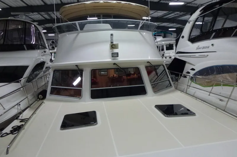 Slide: The Image of 2009 Maine Cat P-47 yacht in a marina, surrounded by other boats. - 9