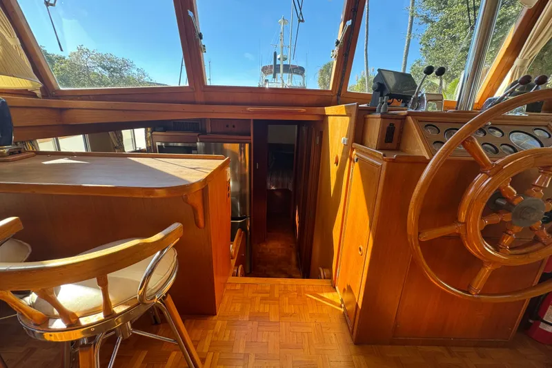 Slide: The Image of Helm of 1990 Grand Banks 46 Classic with wooden wheel and control panel. - 16