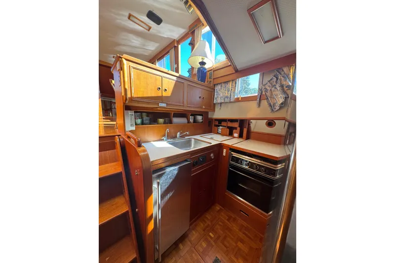Slide: The Image of Interior of 1990 Grand Banks 46 Classic yacht with wooden cabinetry and stairs. - 19