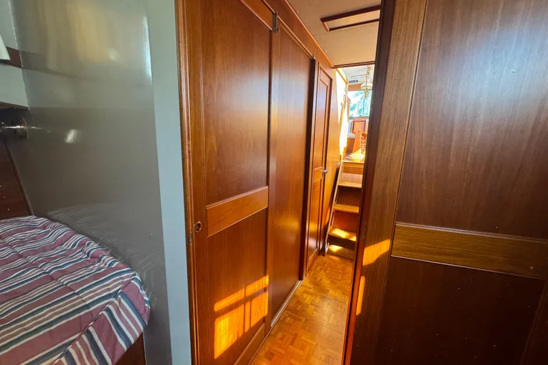 Slide: The Image of Interior of 1990 Grand Banks 46 Classic yacht kitchen with wood cabinetry and stainless steel appliances. - 25