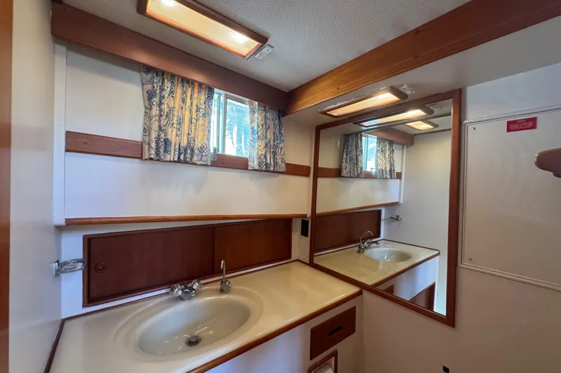 Slide: The Image of Interior of 1990 Grand Banks 46 Classic yacht with wooden cabinetry and parquet flooring. - 37