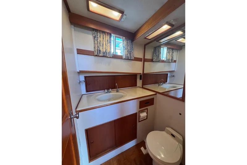 Slide: The Image of Bathroom interior of 1990 Grand Banks 46 Classic yacht with sink and mirror. - 38