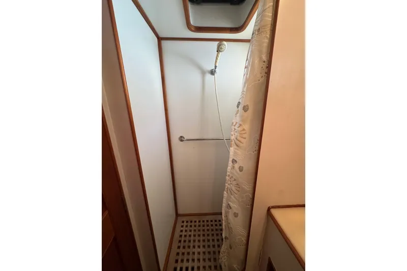 Slide: The Image of Bathroom interior of 1990 Grand Banks 46 Classic yacht, featuring sink, mirror, and toilet. - 39