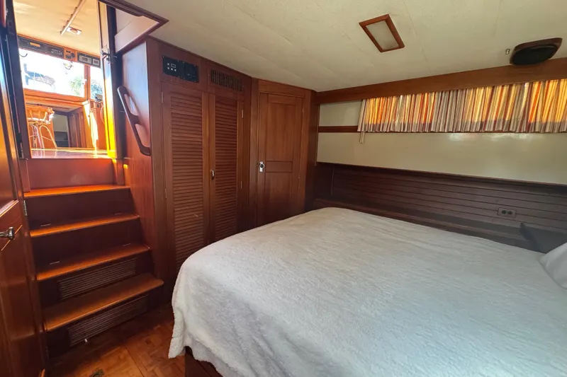 Slide: The Image of Interior of 1990 Grand Banks 46 Classic yacht with wooden stairs and cabinets. - 43