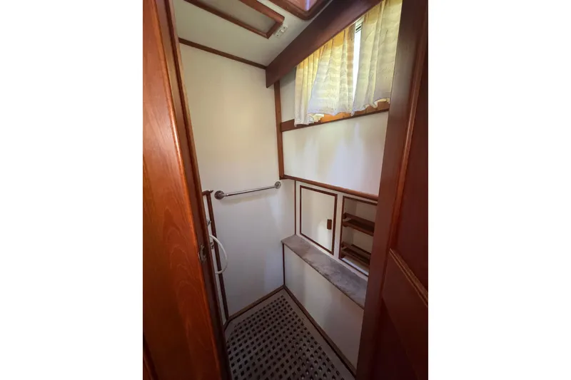 Slide: The Image of Bathroom interior of 1990 Grand Banks 46 Classic yacht, featuring sink and storage cabinets. - 49