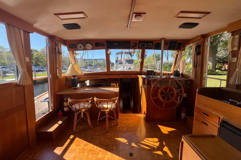 Slide: The Image of Cozy kitchen in 1990 Grand Banks 46 Classic yacht with wooden cabinetry and modern appliances. - 5