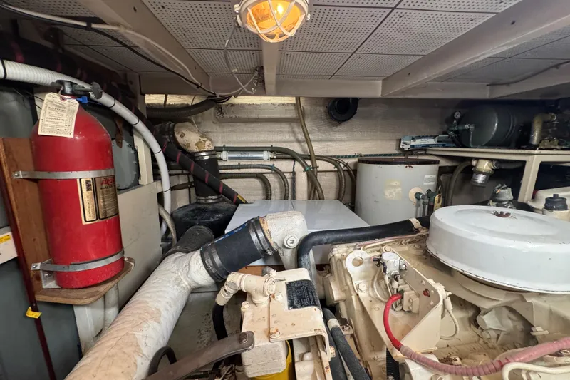 Slide: The Image of Engine room of 1990 Grand Banks 46 Classic yacht with Caterpillar engine and equipment. - 66