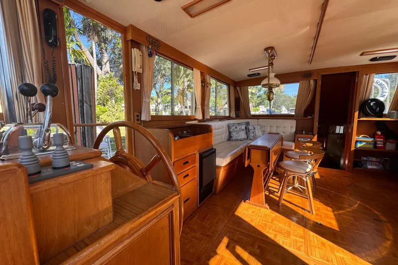 Slide: The Image of Interior of 1990 Grand Banks 46 Classic yacht with wood finish and seating area. - 7