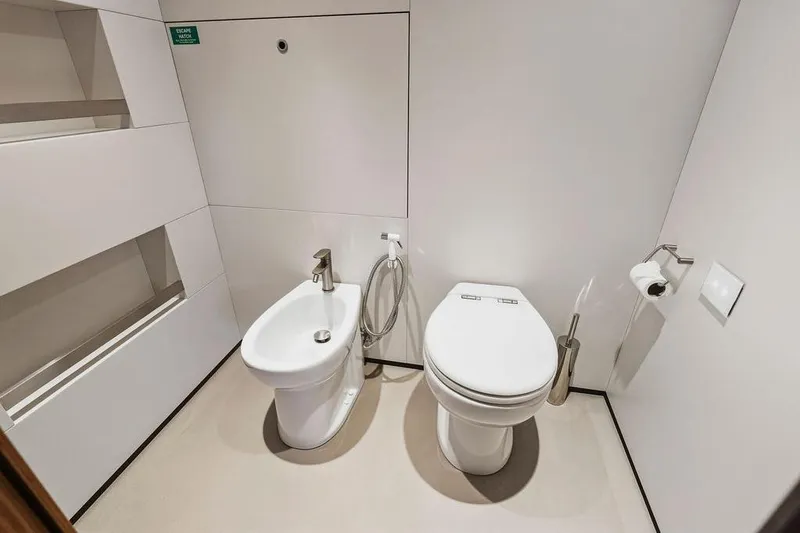 Slide: The Image of Modern bathroom with toilet and bidet on a Custom Line 120 yacht, 2018 model. - 100