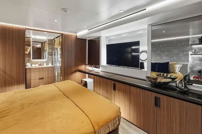 Slide: The Image of Luxurious 2018 Custom Line 120 yacht bedroom with modern decor and elegant furnishings. - 103