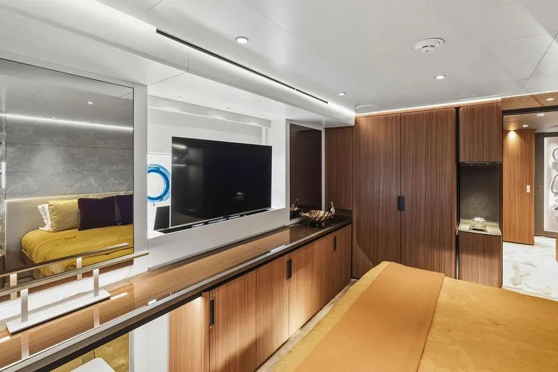 Slide: The Image of Luxurious 2018 Custom Line 120 yacht interior with modern wood paneling and elegant furnishings. - 104
