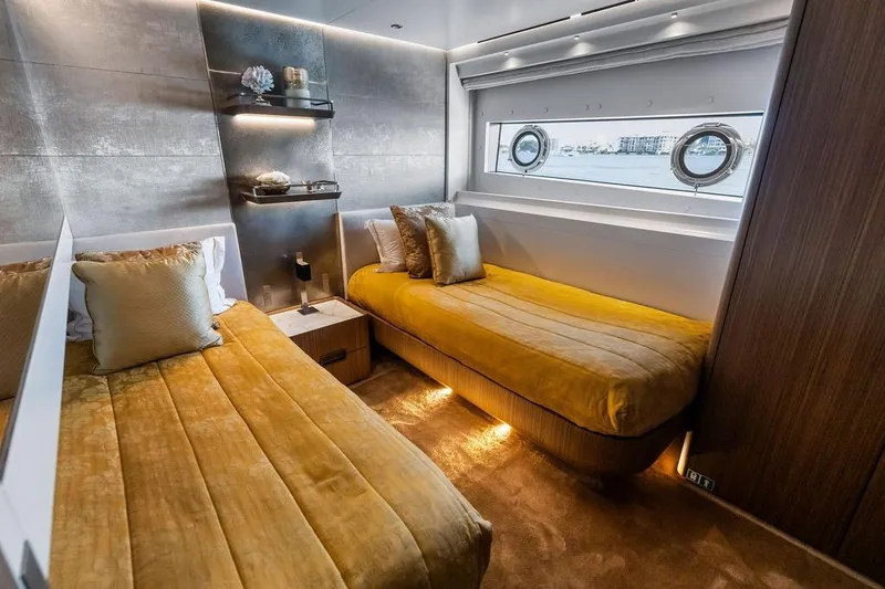 Slide: The Image of Luxurious 2018 Custom Line 120 yacht cabin with twin beds and elegant decor. - 105