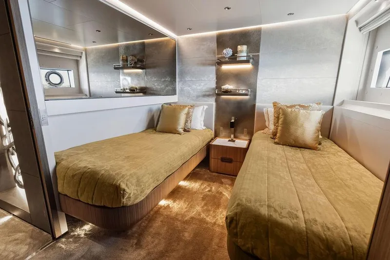 Slide: The Image of Luxurious 2018 Custom Line 120 yacht bedroom with twin beds and elegant decor. - 106