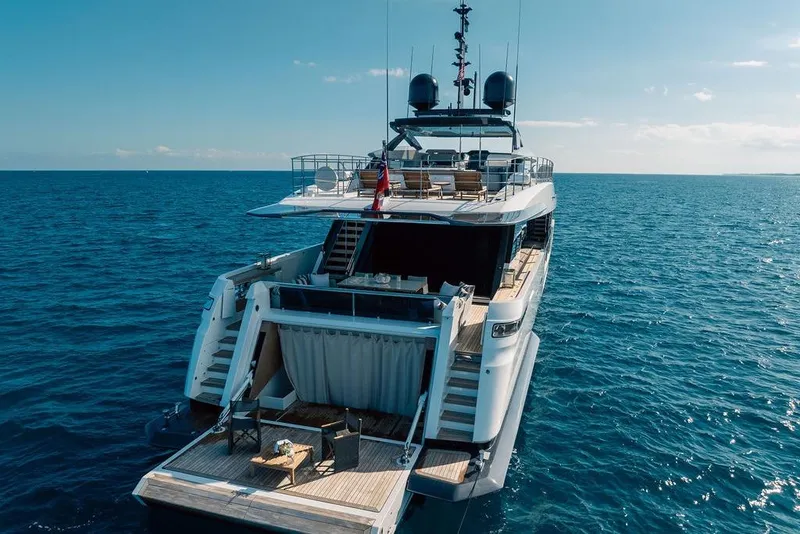 Slide: The Image of Luxurious 2018 Custom Line 120 yacht on open sea, featuring spacious deck and modern design. - 11