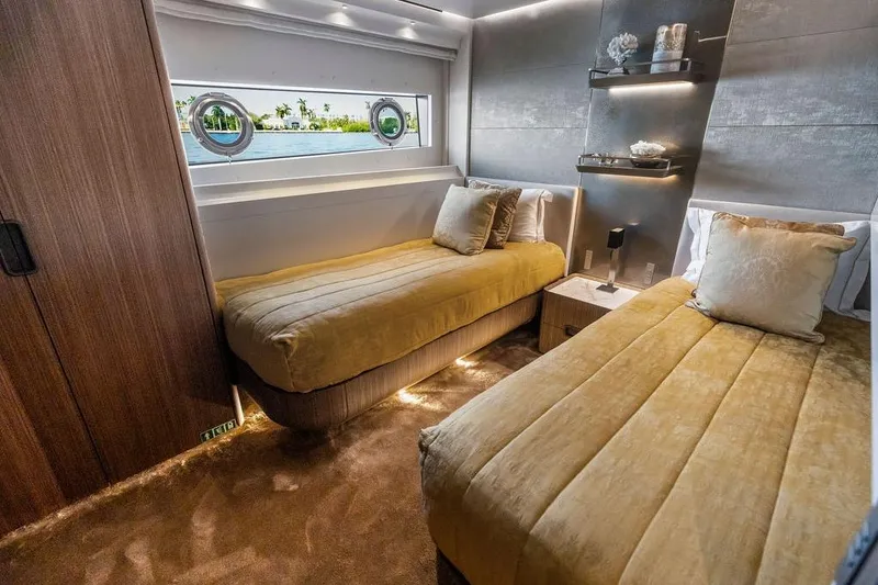 Slide: The Image of Luxurious 2018 Custom Line 120 yacht bedroom with twin beds and elegant decor. - 111