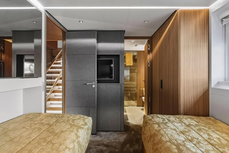 Slide: The Image of Luxurious 2018 Custom Line 120 yacht interior with modern bedroom and elegant wood paneling. - 113