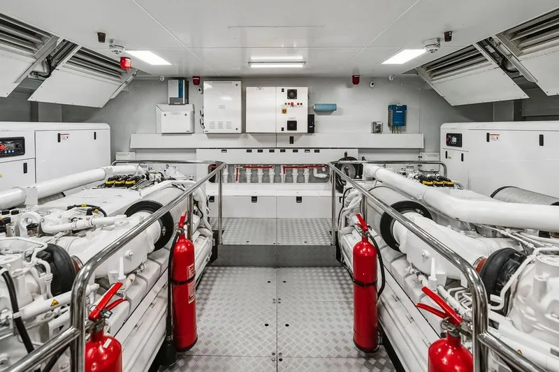 Slide: The Image of Engine room of 2018 Custom Line 120 yacht with modern equipment and safety features. - 124