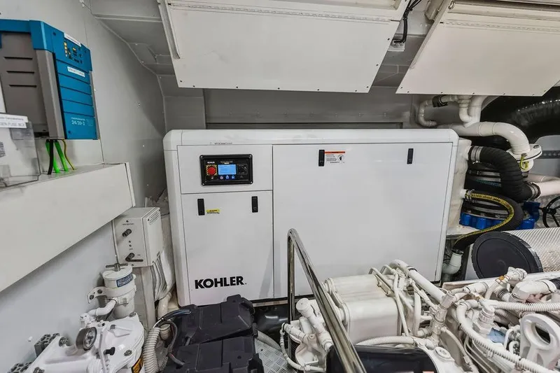 Slide: The Image of Engine room of Custom Line 120 yacht, featuring Kohler generator, 2018 model. - 126