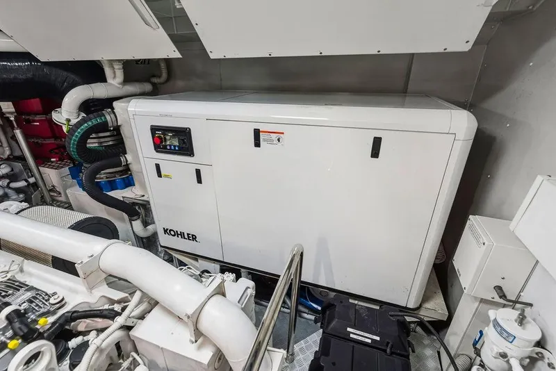 Slide: The Image of Engine room with Kohler generator in a 2018 Custom Line 120 yacht. - 128
