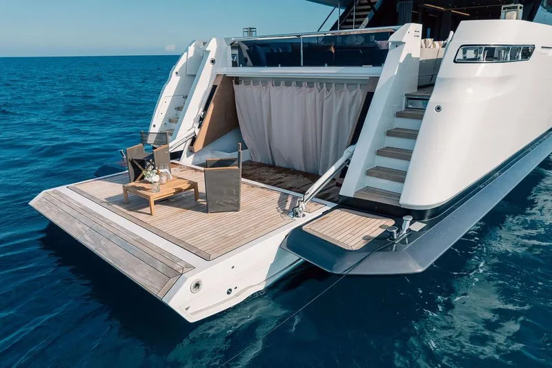 Slide: The Image of Luxury yacht Custom Line 120, 2018 model, with elegant deck and ocean view. - 13