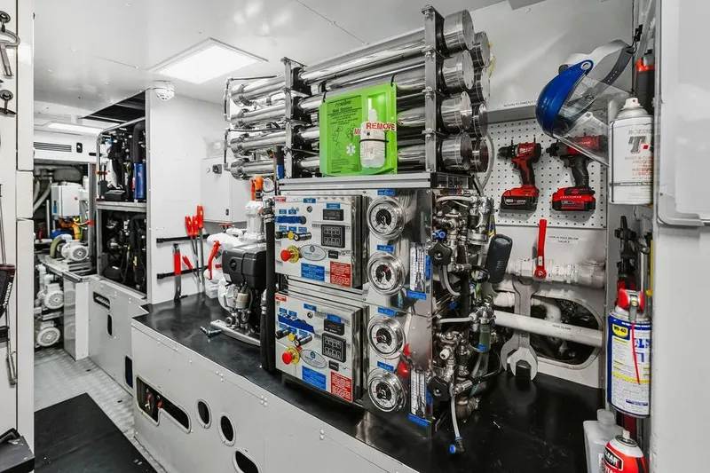 Slide: The Image of Interior of a 2018 Custom Line 120 yacht engine room with advanced machinery and tools. - 130