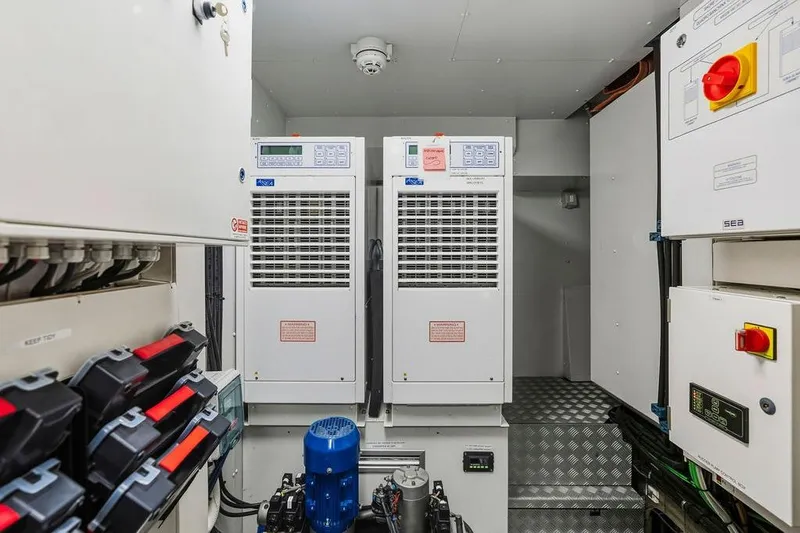 Slide: The Image of Electrical control room with Custom Line 120 equipment, 2018 model, featuring panels and machinery. - 131
