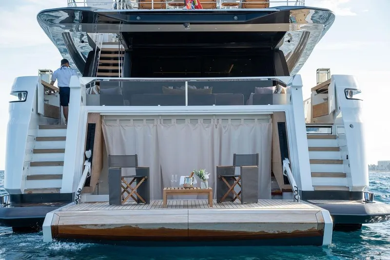 Slide: The Image of Luxury yacht Custom Line 120, 2018 model, featuring elegant outdoor seating area. - 14