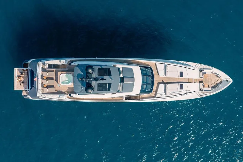 Slide: The Image of Aerial view of 2018 Custom Line 120 yacht on blue ocean water. - 19