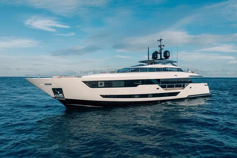 Slide: The Image of Luxurious 2018 Custom Line 120 yacht cruising on open sea under clear blue sky. - 2
