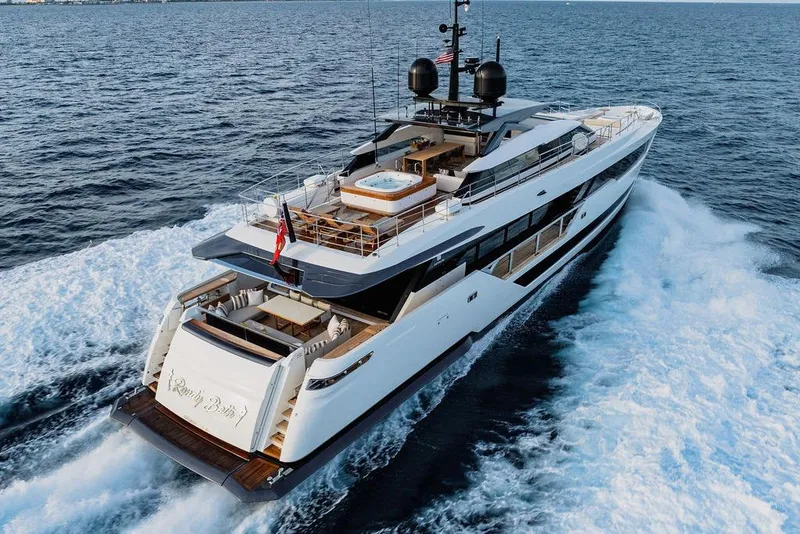 Slide: The Image of Luxurious 2018 Custom Line 120 yacht cruising on open sea, featuring elegant design and spacious deck. - 21