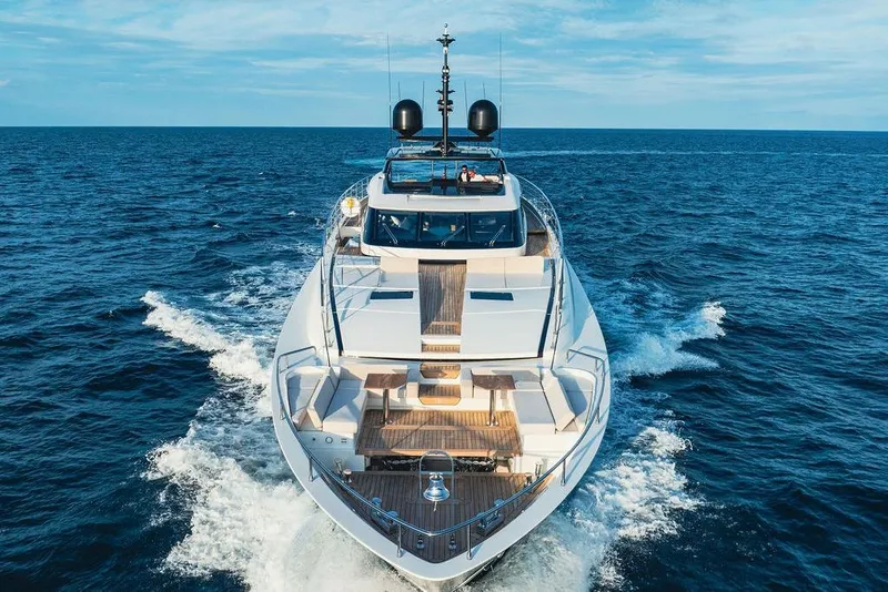 Slide: The Image of Luxurious 2018 Custom Line 120 yacht cruising on open sea under clear skies. - 25