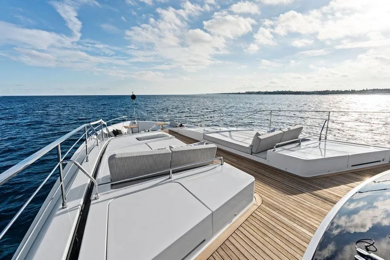 Slide: The Image of Luxurious 2018 Custom Line 120 yacht deck with ocean view and elegant seating. - 27