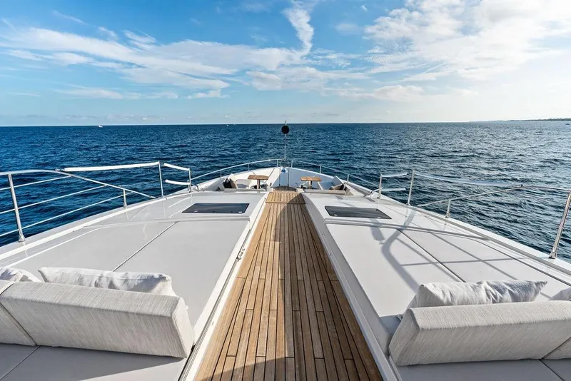 Slide: The Image of Luxurious 2018 Custom Line 120 yacht deck with ocean view and clear skies. - 28