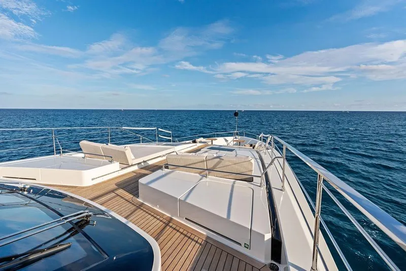 Slide: The Image of Luxurious 2018 Custom Line 120 yacht deck with ocean view and sun loungers. - 29
