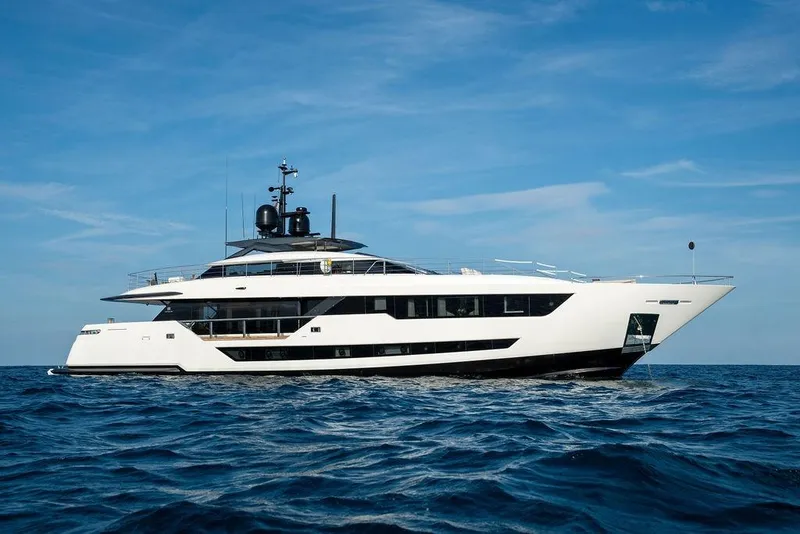 Slide: The Image of Luxurious 2018 Custom Line 120 yacht cruising on open sea under clear blue sky. - 3