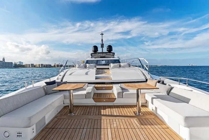 Slide: The Image of Luxurious 2018 Custom Line 120 yacht deck with seating, tables, and ocean view. - 30