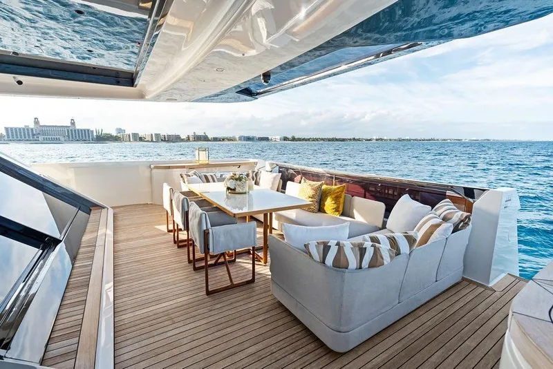 Slide: The Image of Luxurious 2018 Custom Line 120 yacht deck with elegant seating and ocean view. - 31