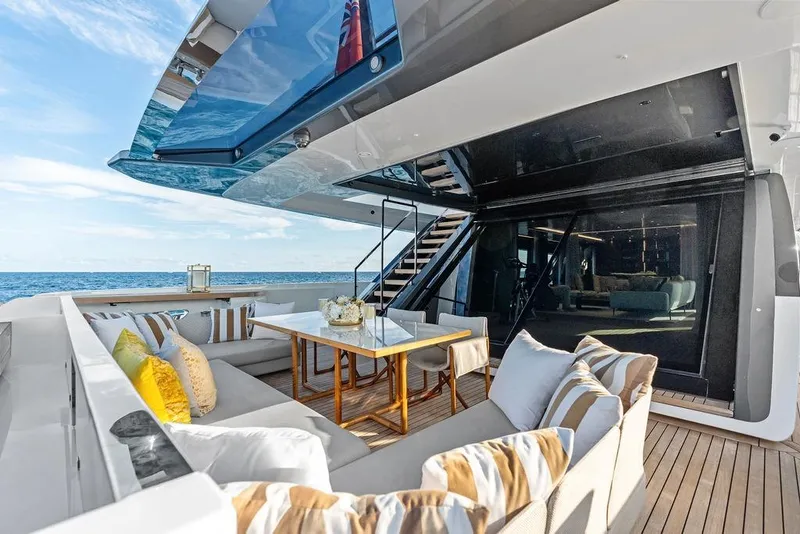 Slide: The Image of Luxurious 2018 Custom Line 120 yacht deck with elegant seating and ocean view. - 32
