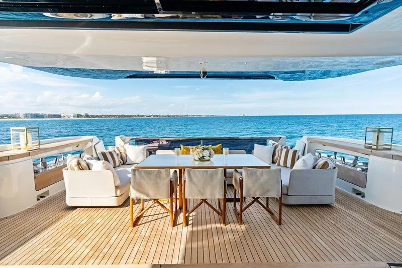 Slide: The Image of Luxurious 2018 Custom Line 120 yacht deck with elegant seating and ocean view. - 36