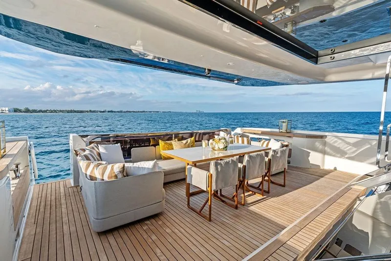 Slide: The Image of Luxurious 2018 Custom Line 120 yacht deck with elegant seating and ocean view. - 37