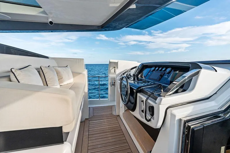 Slide: The Image of Luxurious 2018 Custom Line 120 yacht cockpit with plush seating and ocean view. - 39