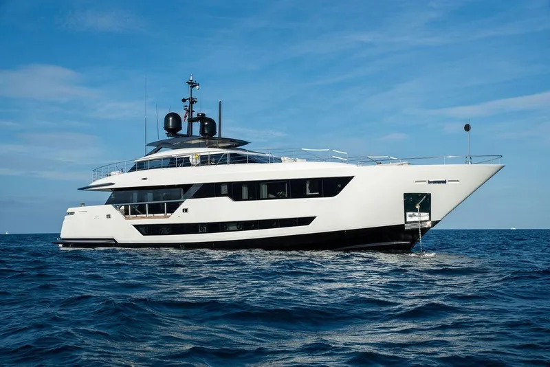 Slide: The Image of Luxurious 2018 Custom Line 120 yacht cruising on open sea under clear blue sky. - 4
