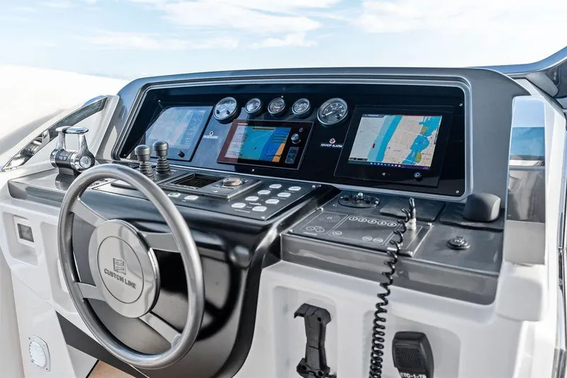 Slide: The Image of Cockpit of 2018 Custom Line 120 yacht with advanced navigation systems and controls. - 41