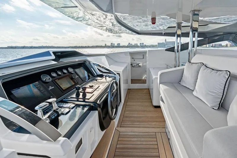 Slide: The Image of Luxurious 2018 Custom Line 120 yacht interior with modern helm and comfortable seating. - 42