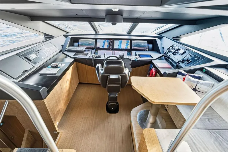 Slide: The Image of Luxurious 2018 Custom Line 120 yacht cockpit with modern navigation systems and elegant interior design. - 49