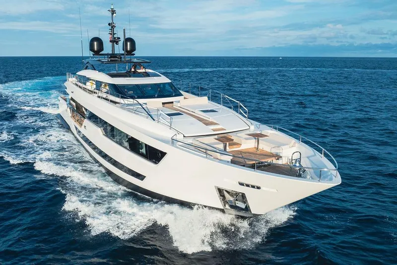 Slide: The Image of Luxurious 2018 Custom Line 120 yacht cruising on open sea under clear skies. - 5